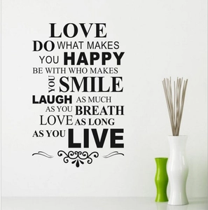 Sticker mural House Rule noir avec des motifs floraux élégants sur le bas du lettrage