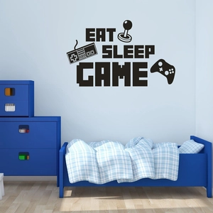 Détail du sticker mural Eat Sleep Game avec icônes de manette sur un mur bleu de chambre