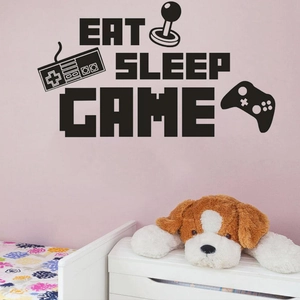 Détail du sticker mural Eat Sleep Game avec icônes de manettes dans une chambre
