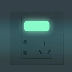 Deep grey five-hole wall socket with glowing green LED indicator for night visibility