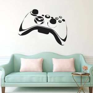 Détail du sticker mural manette de jeu avec boutons ABXY dans un salon moderne