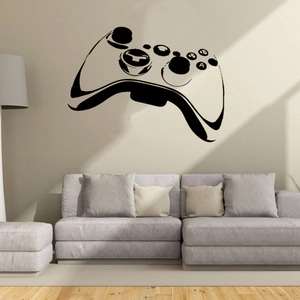 Sticker mural manette de jeu moderne au-dessus d'un canapé dans un salon minimaliste