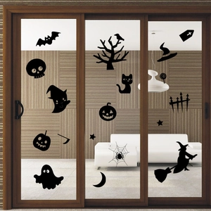 Detail of Halloween silhouette decals featuring pumpkins and ghosts on glass doors
