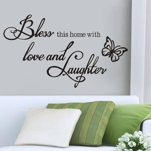 Bless this home vinyl wall sticker with butterflies in a modern living room setting
