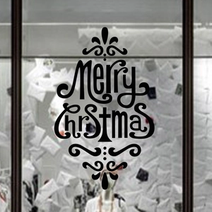 Macro detail of Merry Christmas wall decal in artistic tree shape on glass surface