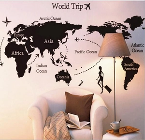 Self-adhesive black world map wall sticker with continents and World Trip traveler silhouettes