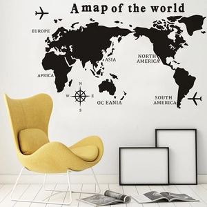 Minimalist black world map wall decal with continent names and compass for home decor