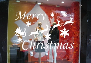White Christmas window decals set with Merry Christmas text, snowflakes and flying reindeers