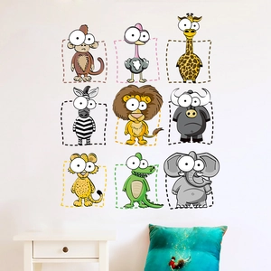 Cartoon animal wall stickers set featuring lion, elephant and giraffe for nursery decor