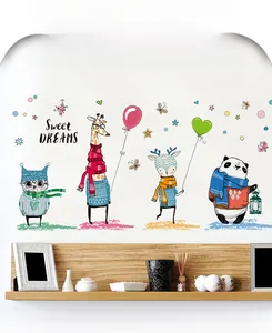 Detail of happy animal wall stickers with owls and giraffes for cozy kids bedroom decor