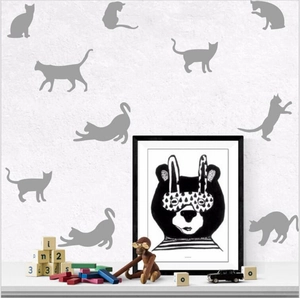 Minimalist grey cat silhouette wall decals in various poses for home nursery decor