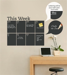 Macro detail of This Week chalkboard wall sticker with grid layout and shopping list area