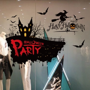 Detail of Halloween witch silhouette wall decals applied on a glass storefront window