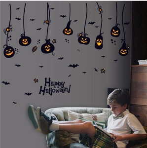 Halloween pumpkin wall stickers and Happy Halloween banner displayed on living room wall