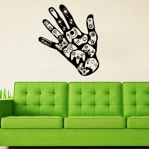 Detailed view of hand-shaped game controller wall decal on a white bedroom wall