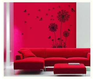 Detailed close-up of black dandelion wall stickers with flying butterflies on wall