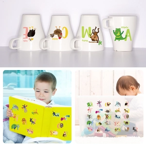 Educational animal alphabet stickers applied to ceramic mug and storage boxes