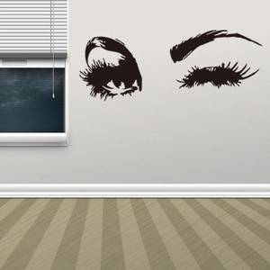 Sticker mural moderne représentant des yeux de femme noirs avec de longs cils pour la déco