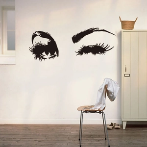 Sticker mural cils noirs avec sourcils pour une décoration de chambre moderne