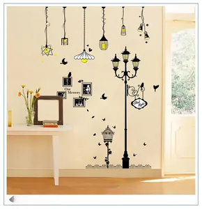 Detail of creative wall stickers with black silhouette chandeliers and photo frames