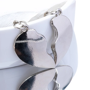 Polished alloy heart puzzle keychain for couples with glossy silver mirror finish