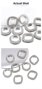 Detail showing polished silver geometric hollow pendants with intricate texture for DIY jewelry