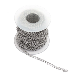 Macro shot of silver stainless steel chain on a plastic spool for DIY jewelry making