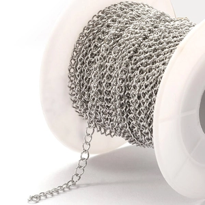 Polished stainless steel cable chain on a white spool for DIY jewelry making