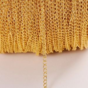 Golden plated O-link iron chain on a spool for DIY jewelry and necklace crafting