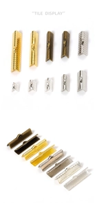 Macro shot of assorted multi-color metal ribbon crimp ends for DIY jewelry making