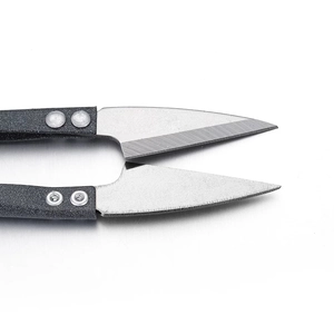Close-up of sharp stainless steel U-shaped sewing scissors with matte anti-slip handle