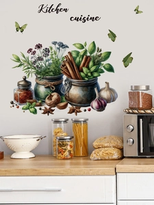 Detail of PVC kitchen wall decal with green plants, spices, and Kitchen Cuisine lettering