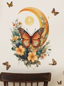 Detailed close-up of butterfly and moon PVC wall stickers in warm orange and yellow tones