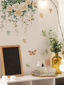 Detailed wall sticker featuring cream rose hanging clusters and colorful butterflies on wall