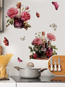 Detail of vintage pink rose wall decals with butterfly motifs in a home kitchen setting