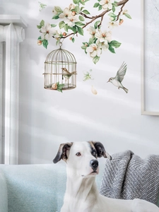 Detail of white flower wall decals with bird cage for home living room decor