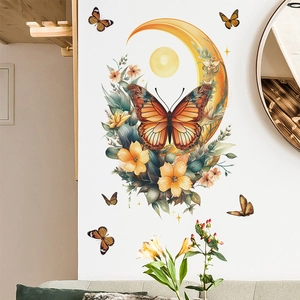 Artistic butterfly moon wall sticker set in living room with flowers and warm orange tones