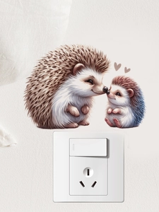 Détail de stickers muraux hérissons mignons placés autour d'un interrupteur blanc au mur