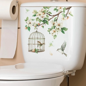 Waterproof PVC wall sticker featuring white flowers, birds, and birdcage for home decor