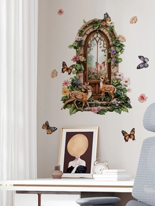 Detail of PVC wall sticker with a deer and floral arch window in a fairy tale style