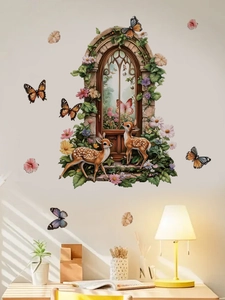 Detail of DIY floral deer wall stickers on a beige wall showing stones and petals