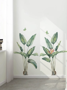 Detail of tropical green plant wall stickers with watercolor leaf and butterfly accents
