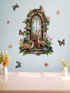Detail showing self-adhesive wall stickers with deer and garden window on blue background