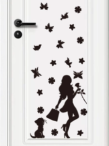 Detail view of black silhouette wall sticker featuring a woman, cat, and flowers on a door