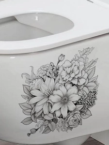 Gros plan de stickers floraux dessinés à la main en noir et blanc sur un réservoir