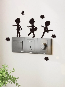 Detail of black ballerina silhouette wall decals on a wall above a light switch