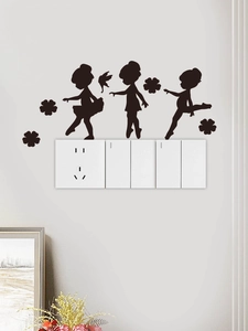 Detail of three black ballerina silhouettes and butterfly wall stickers on white wall