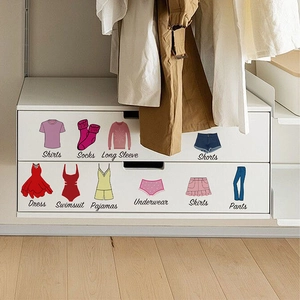 Clothing organization labels for drawers with icons for shirts and socks on white cabinet