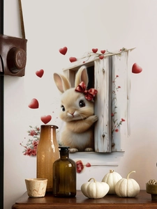 Detail of cute brown bunny wall sticker with red hearts and floral accents in home setting