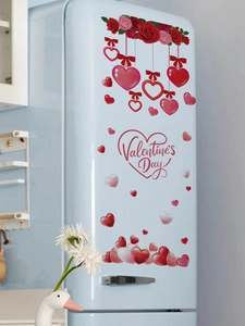 Detail view of red rose and heart PVC wall stickers with Valentine's Day text on a fridge